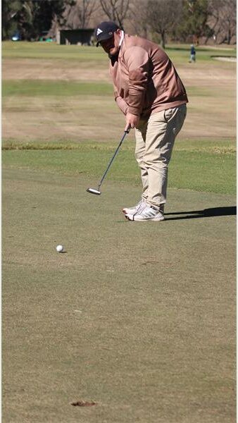 golf player in a brown jacket