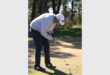 golf player in a white jacket