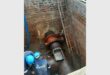 Workers repair the key bulk water supply valve at Graceland Hotel, Casino and Country Club.