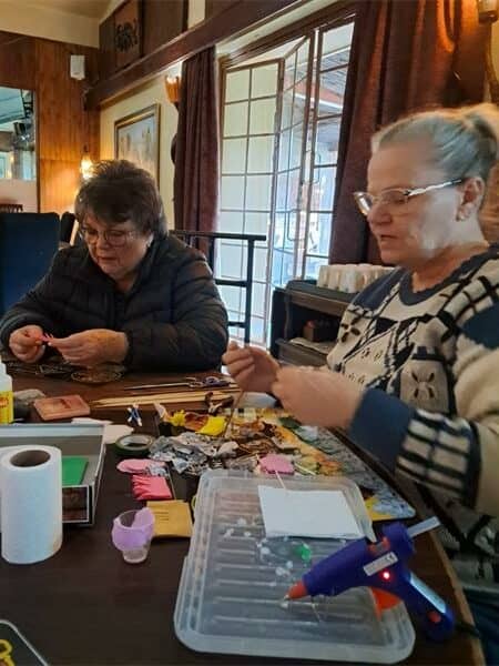 women are making paper flowers
