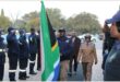 people with an SA flag and an honorary guard