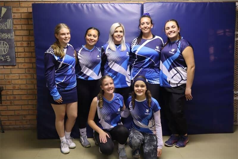 a team of women in blue sport kits