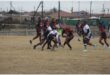 tow rugby teams vie for the ball