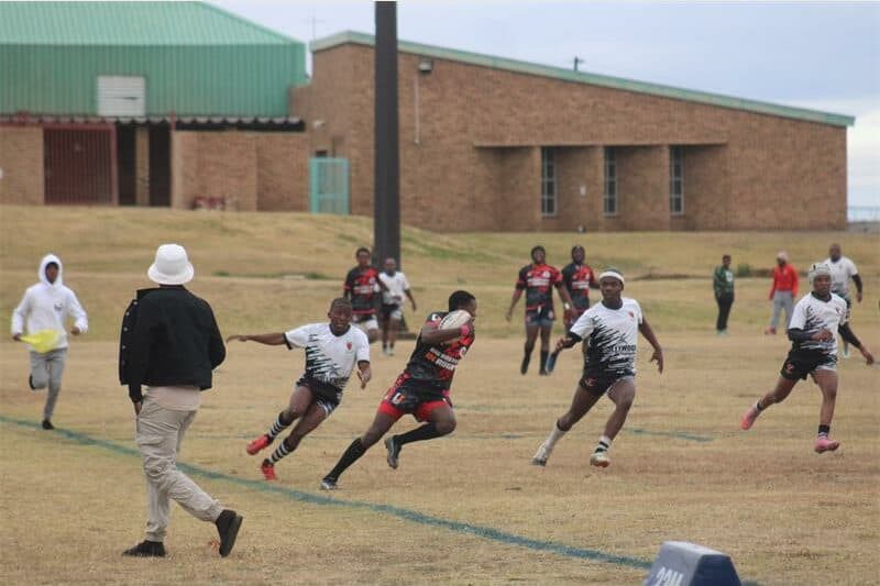 two rugby teams vie for the ball