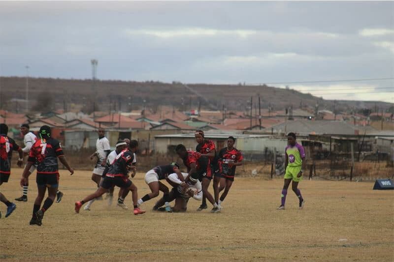 two rugby teams vie for the ball