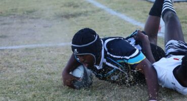 a rugby player scores a try.