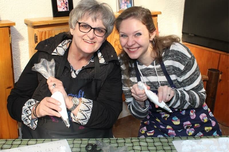two women with piping bags in their hands