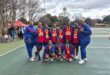 sport team in blue with red bibs