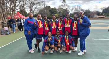 sport team in blue with red bibs
