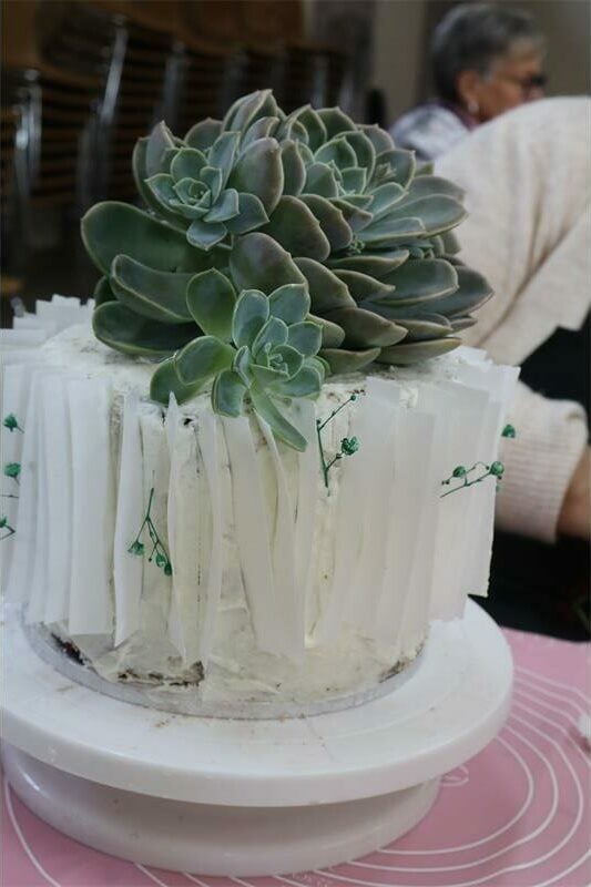 a cake decorated with wafer paper