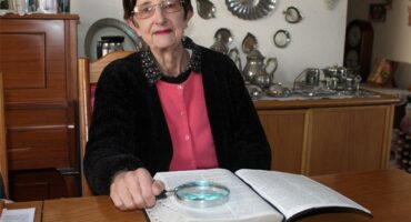 woman with a bible and a looking glass