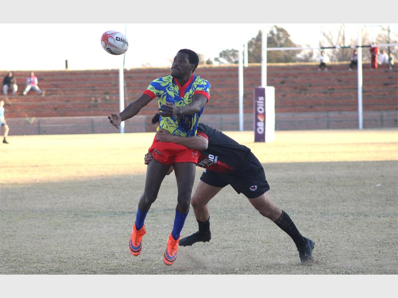 A rugby player gets tackled