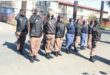 people in uniform salute