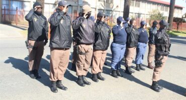 people in uniform salute