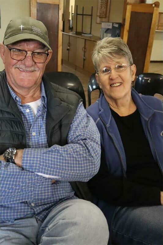 elderly couple smiling at an event