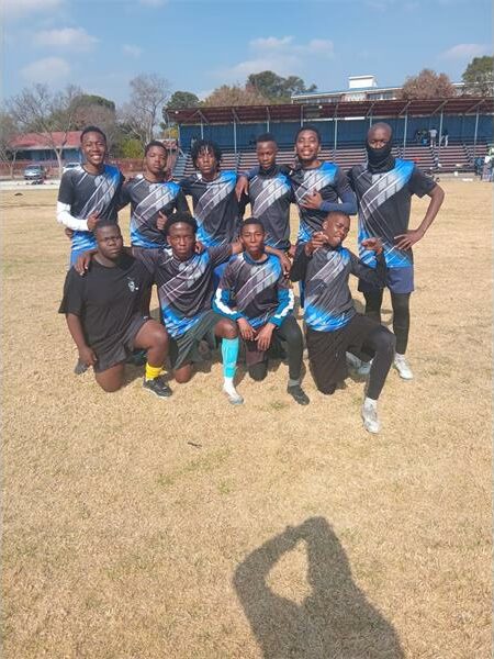 a sports team in blue and black kits