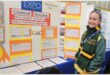 girl in front of an expo presentation