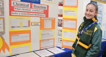 girl in front of an expo presentation