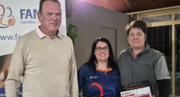 a tall man and two women