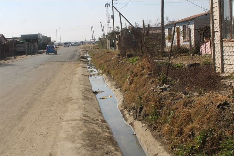 sewage flows down a street