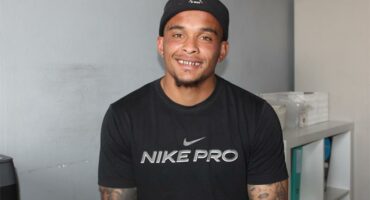man with a black nike t shirt and silkousie