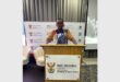 boy standing behind a podium