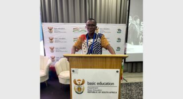 boy standing behind a podium