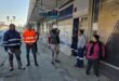 people stand around outside a store