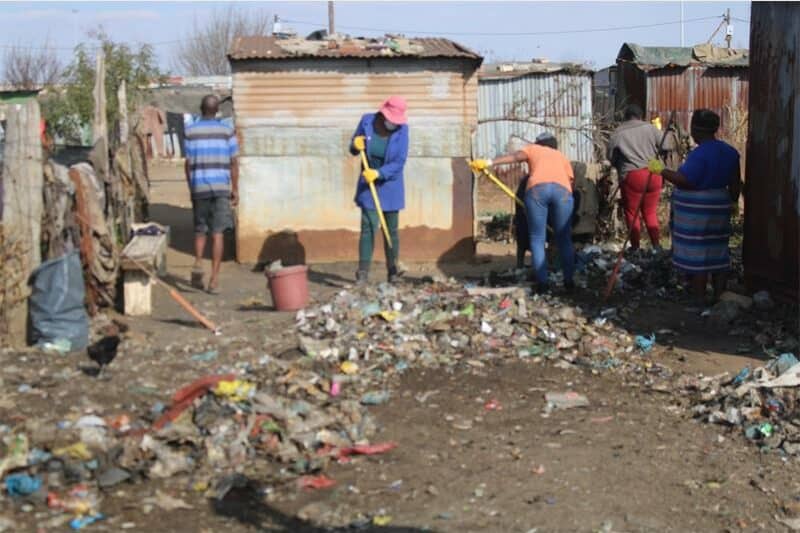 people clean up rubbish