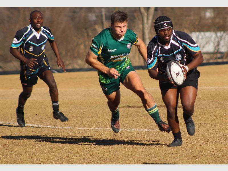 a rugby player runs with the ball