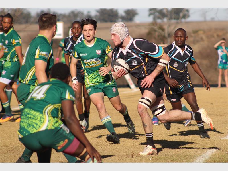 a rugby player runs with the ball