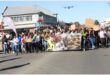 a group of people march in the street