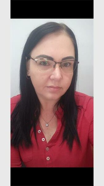 a woman with a red dress and glasses