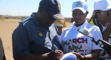 Two people look at a memorandum