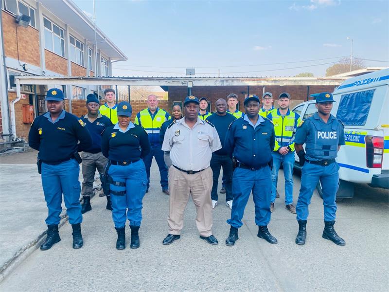 People in uniforms patrol the road