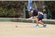man in blue playing bowls
