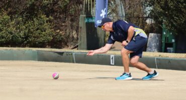 man in blue playing bowls