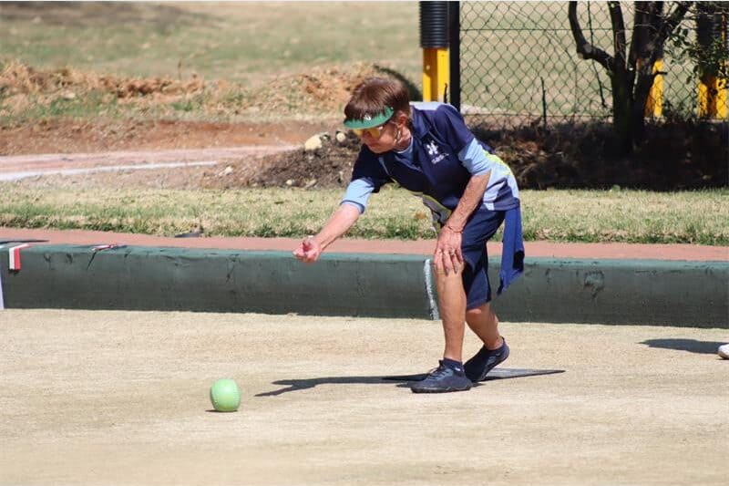 A woman playing bowls