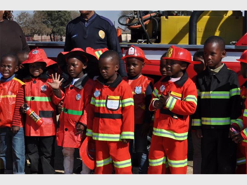 children dressed as fire fighters