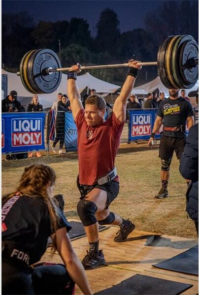 a man pushing up weights