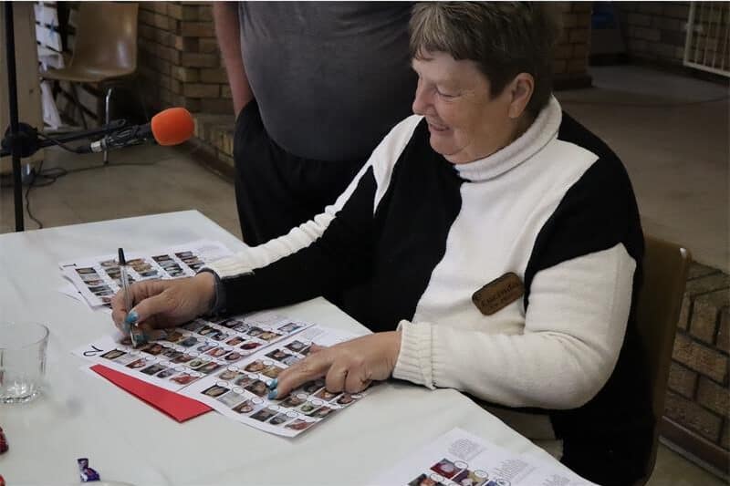 a woman stares at a a page with photos