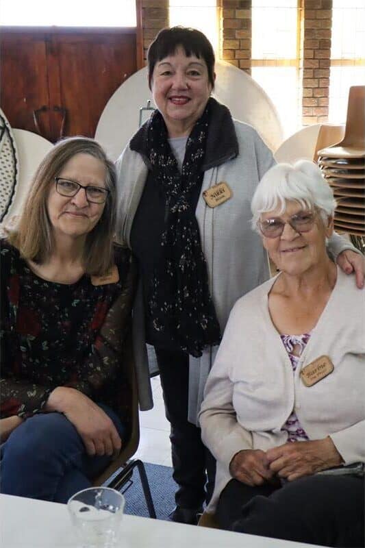 Old people pose together