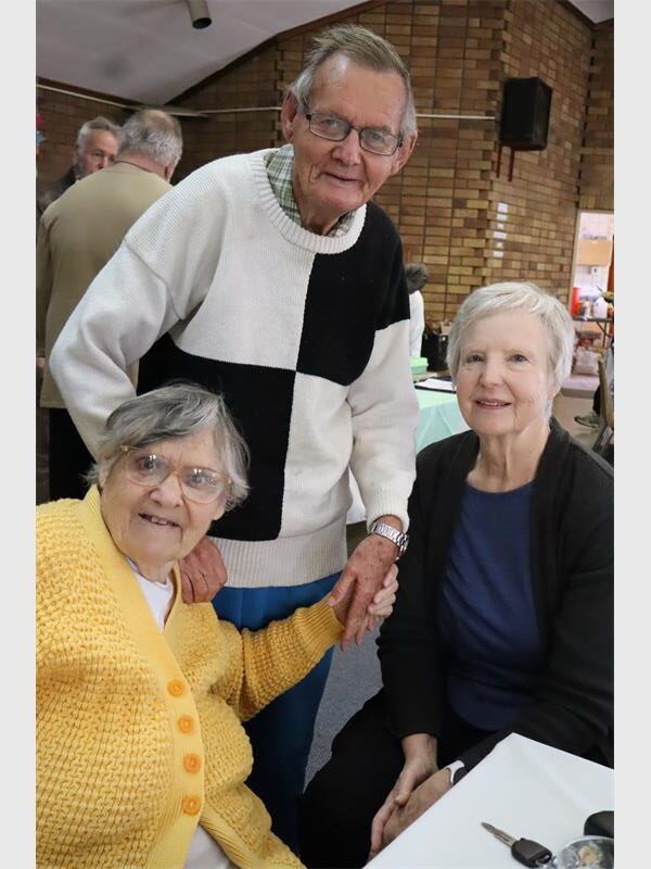 Old people pose together