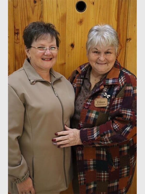 two women wearing jackets