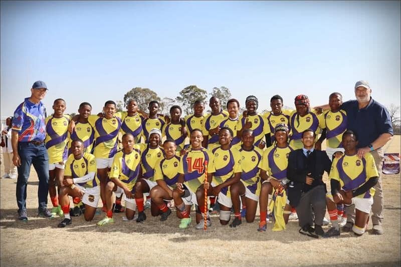 a rugby team with yellow jerseys