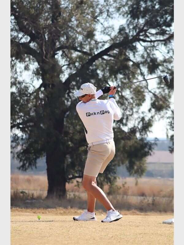 a man in short pants plays golf