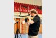 a girl aims to shoot at a target