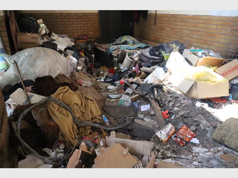 Rubbish strewn everywhere inside a building