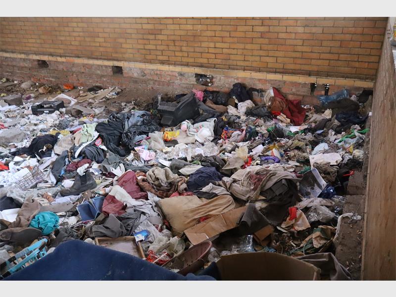 Rubbish strewn everywhere inside a building