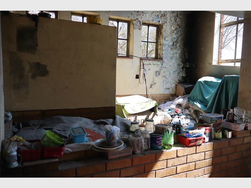 Rubbish strewn everywhere inside a building